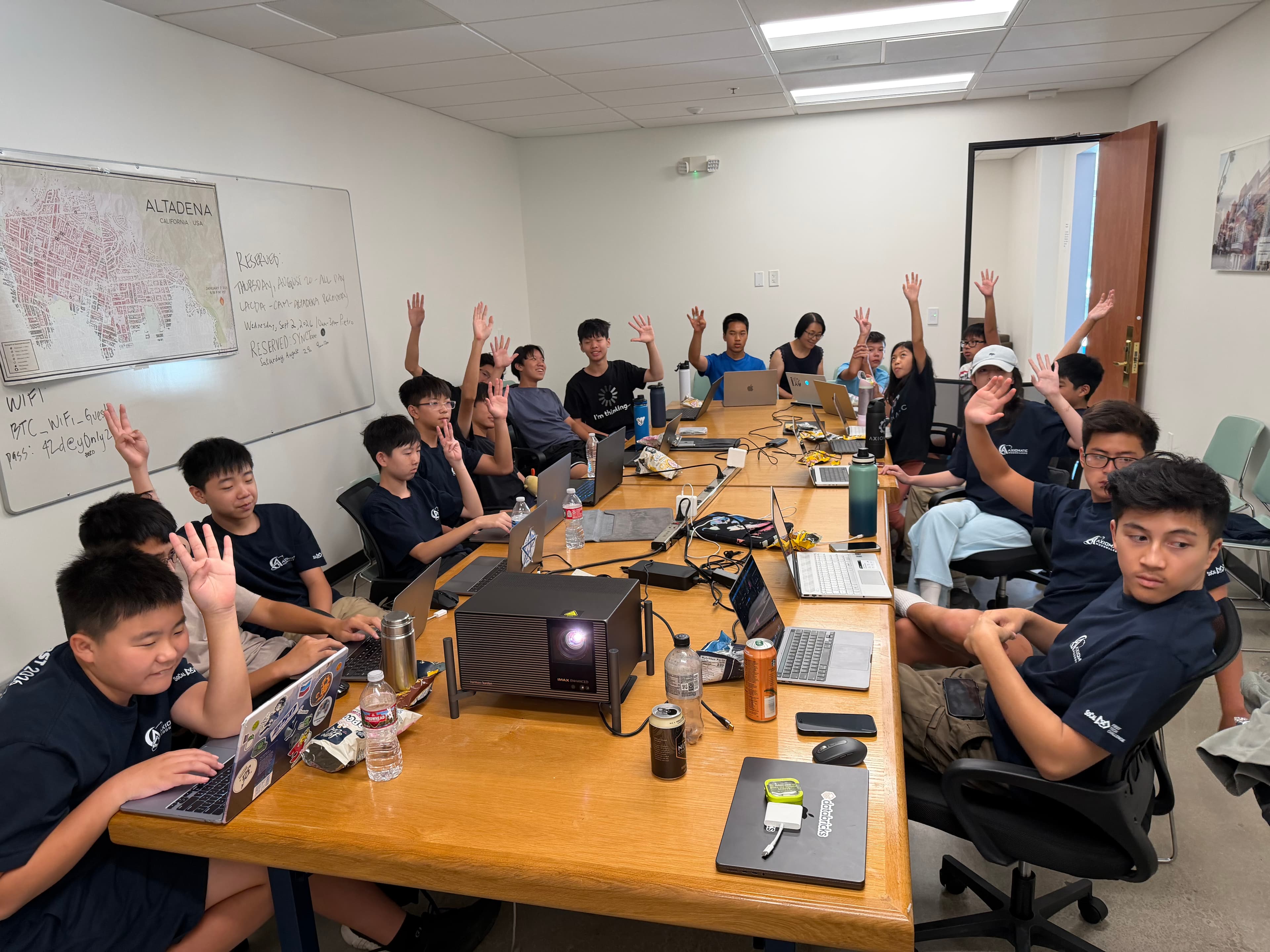 Instructors guiding students through the app-building workshop